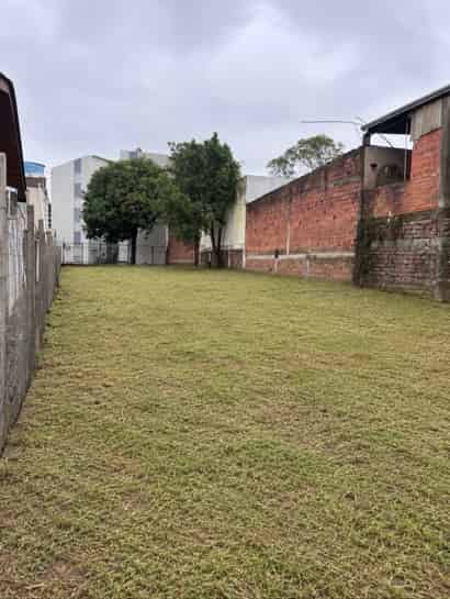 Terreno plano totalmente cercado em via asfaltada na dívida de Novo Hamburgo com Campo Bom.